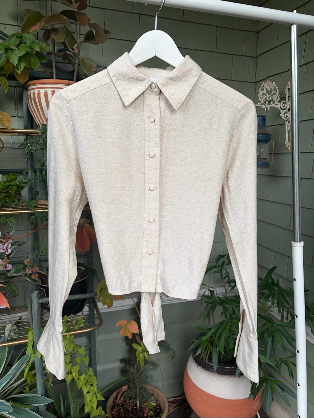 Beige button up long sleeve wrap top with bell sleeves